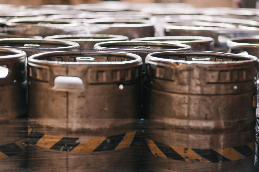 A row of beer kegs.