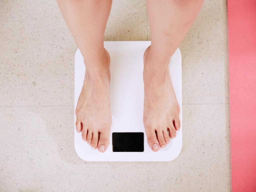 People measure their weight.