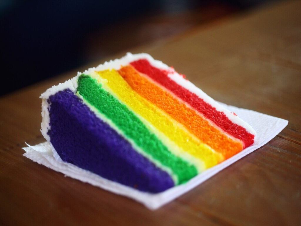 A slice of rainbow cake.