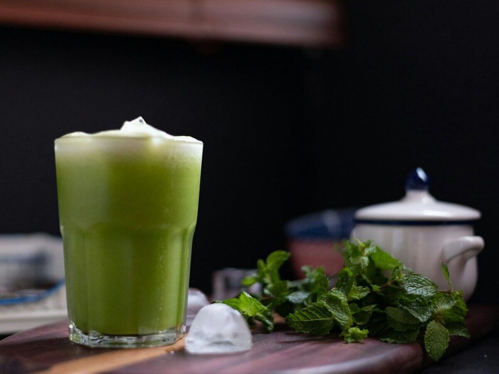A glass of green detox juice.