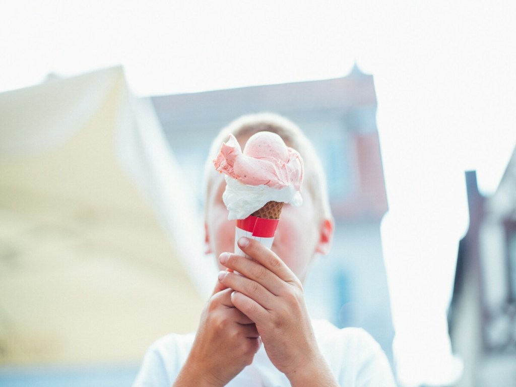 A little boy eating ice cream.