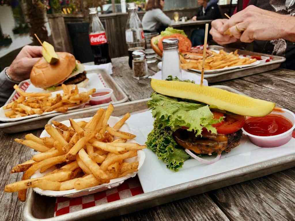 Burgers and fries served in a restaurant.
