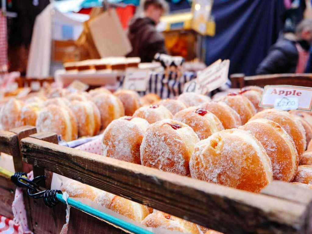 Sugar coated donuts for sale in the market.